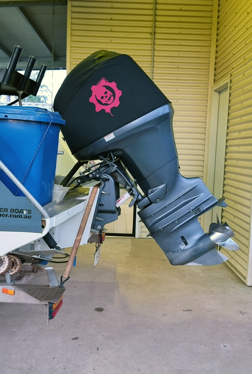 Yamaha F150 four stroke Twin outboard motor covers creating a wake on the back of a boat